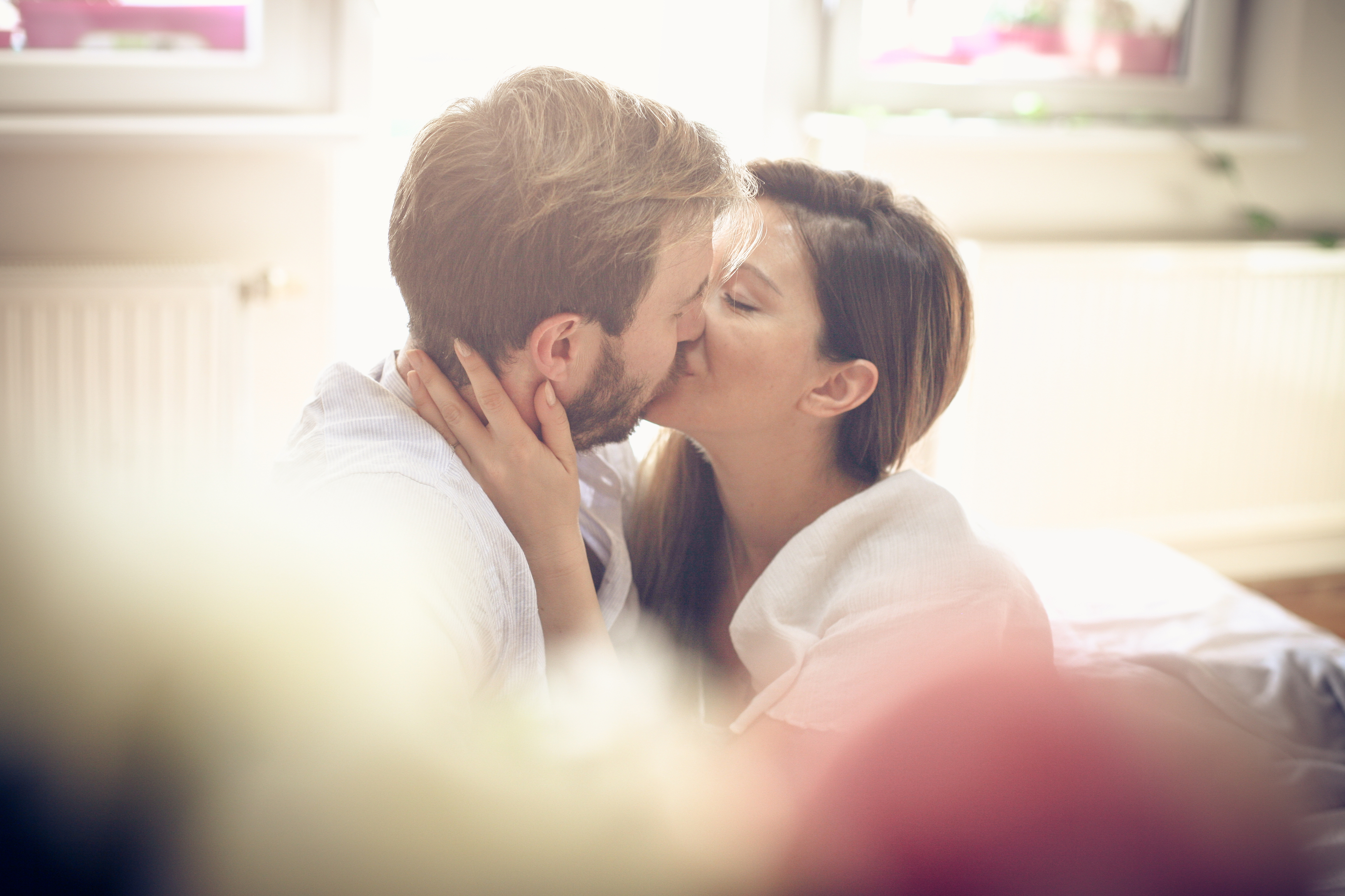 A couple enjoying a sexy moment together while kissing - thedatingdivascom.bigscoots-staging.com A man and woman making out to spice up their sex life | The Dating Divas