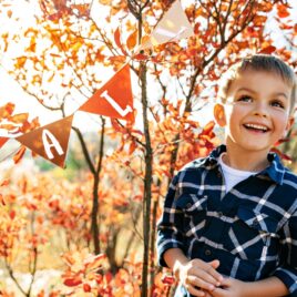 Little boy stands in front of Thanksgiving printable | Date Your Spouse