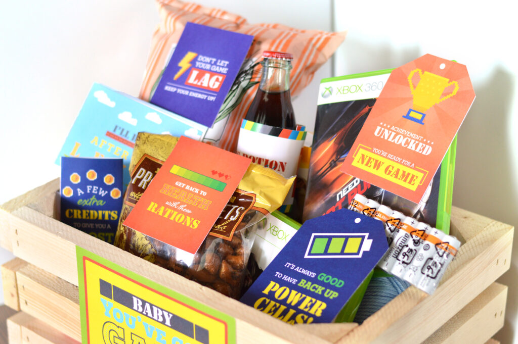 Gamer anniversary gifts for him basket - dateyourspouse.com A basket filled with video game anniversary gifts for him. | The Dating Divas