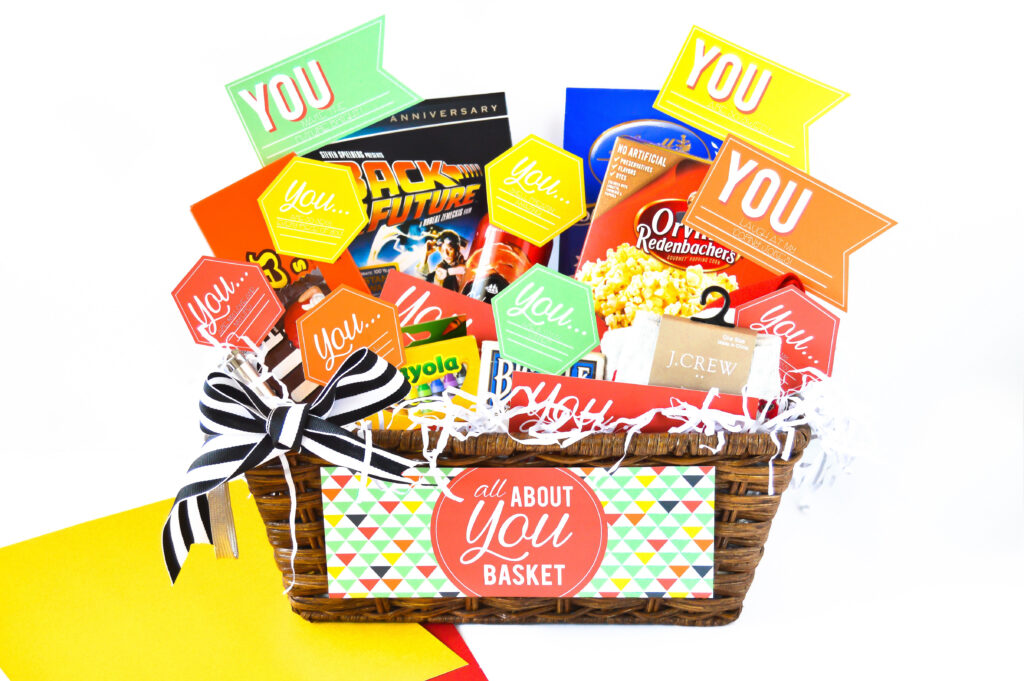 Anniversary gifts for him inside of a basket - dateyourspouse.com An All About You basket that's filled with anniversary gifts for him. | The Dating Divas