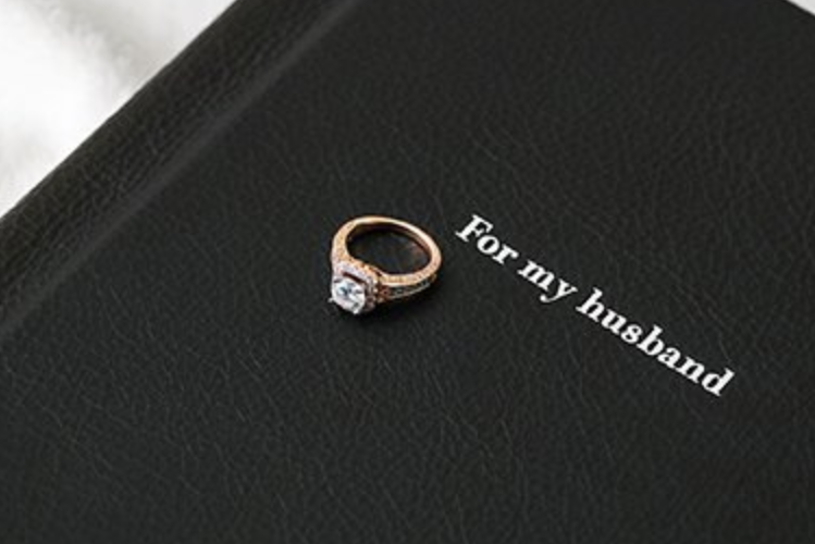 A personalized photo album for fill with memories and photo anniversary gifts for him - dateyourspouse.com Check out these anniversary gifts for him and get this boudoir photo album. | The Dating Divas