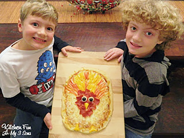 Kid-made Thanksgiving Pizza - www.TheDatingDivas.com Let the kids make one of these Thanksgiving food ideas - a turkey pizza! | The Dating Divas