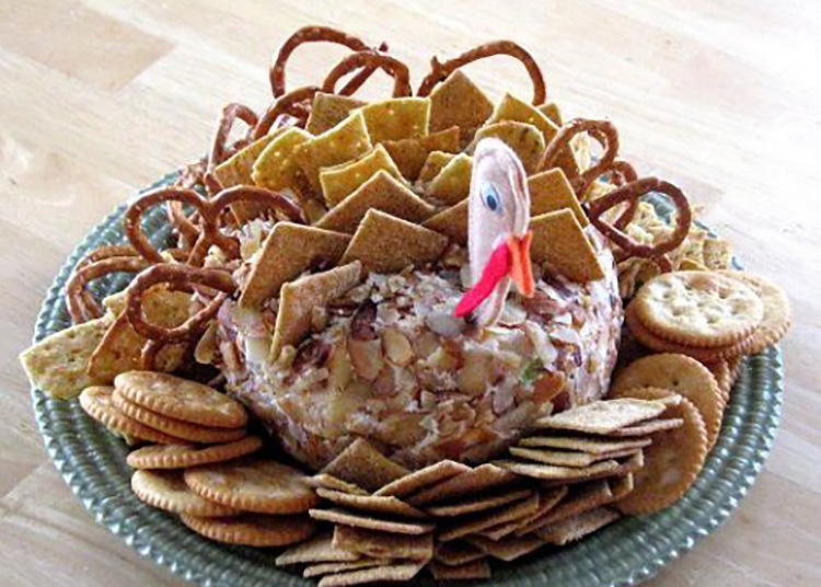 Turkey-Shaped Thanksgiving Cheeseball - www.TheDatingDivas.com Jazz up your cheeseball with these Thanksgiving food ideas in a turkey shape. | The Dating Divas