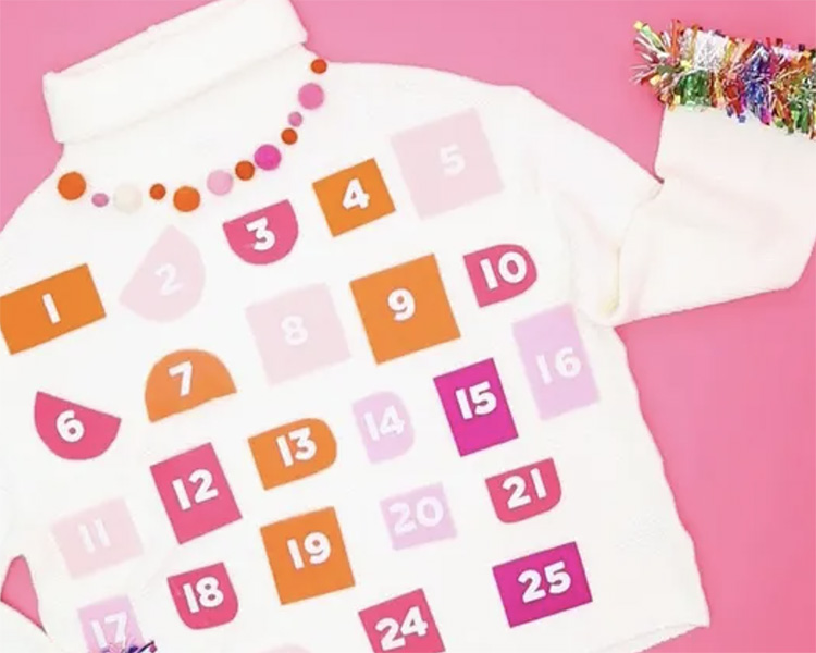Ugly Christmas sweater DIY advent calendar - www.TheDatingDivas.com White Sweater With Colorful Pockets as one of the Best Ugly Christmas Sweater Ideas | The Dating Divas