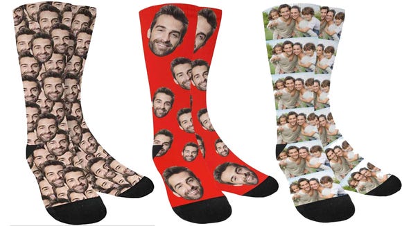 Boyfriend enjoying his custom face socks for Christmas this year - dateyourspouse.com A funny Christmas gift idea for your man | The Dating Divas