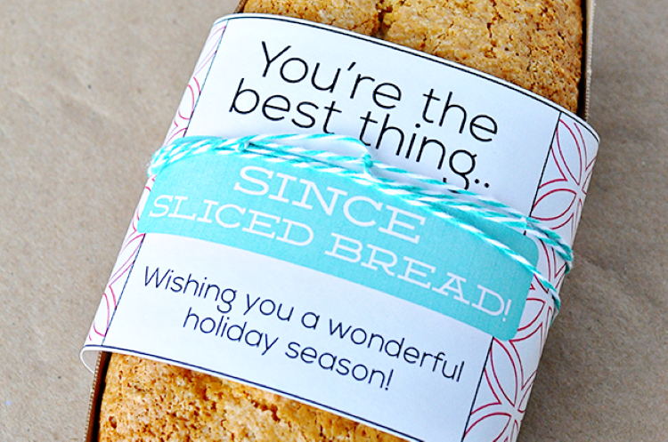 A paper label wrapped around a fresh loaf of bread - dateyourspouse.com A loaf of bread with a holiday gift tag wrapped around the front of it | The Dating Divas