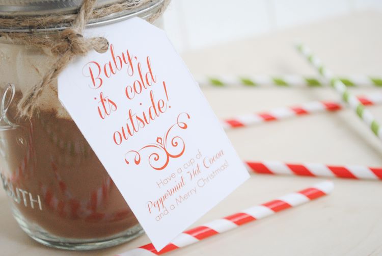 A jar of peppermint hot cocoa wrapped with twine and a gift tag - dateyourspouse.com A glass jar filled with homemade peppermint hot cocoa | The Dating Divas