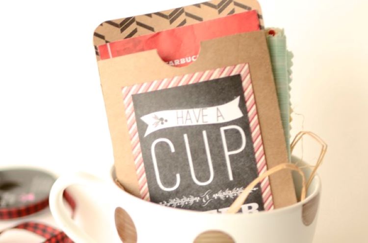 A cute mug filled with cocoa and gift cards - dateyourspouse.com Hot cocoa packets and a gift card inside of a mug | The Dating Divas