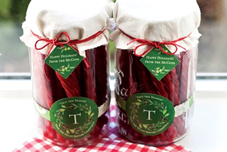 Two jars filled with candy for a fun Christmas gift for a neighbor - dateyourspouse.com A couple of jars filled with Twizzlers for a Christmas gift idea | The Dating Divas