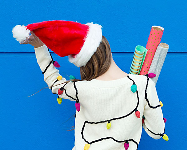 An ugly Christmas sweater idea with crocheted Christmas lights - www.TheDatingDivas.com Girl in crocheted Christmas Lights Ugly Sweater. | The Dating Divas