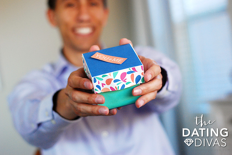 Christmas gift of an Exploding Love Box - dateyourspouse.com A man holding a Exploding Love Box for a wonderful Christmas gift | The Dating Divas