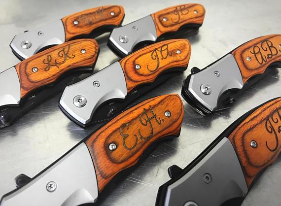 Boyfriend using his personalized knife Christmas gift - dateyourspouse.com Husband enjoying his personalized Knife from his wife | The Dating Divas