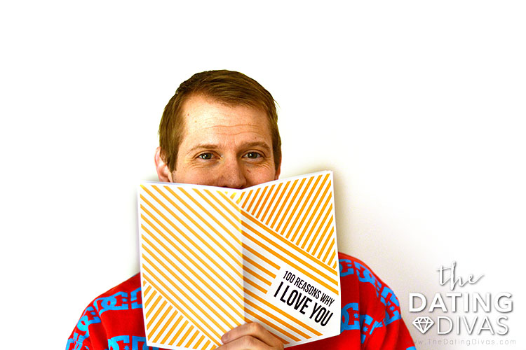 A boyfriend enjoying his personalized Christmas gift - dateyourspouse.com A man showing off his 100 Reasons Why I Love You Christmas gift | The Dating Divas