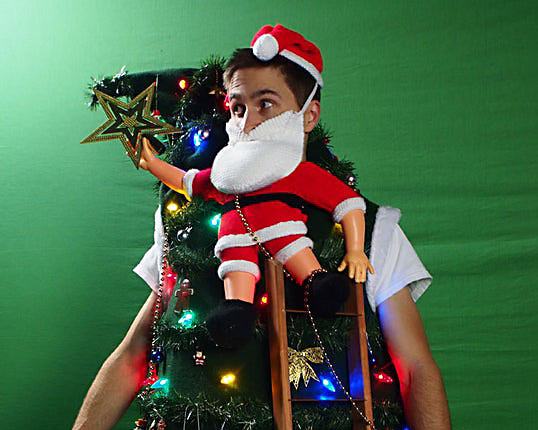 Ugly Christmas sweater contest winning idea with Santa tipping the tree - www.TheDatingDivas.com Santa Tipping Over the Christmas Tree Ugly Christmas Sweater Contest Winner | The Dating Divas