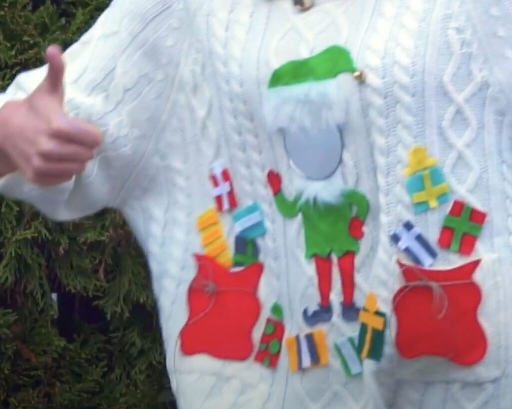 Elf face in a mirror ugly sweater idea - www.TheDatingDivas.com DIY Ugly Sweater Idea for Elf-Themed Sweater with Presents | The Dating Divas