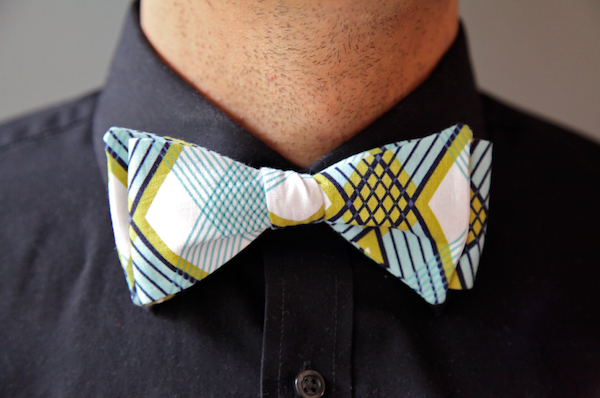 A man wearing his bowtie Christmas gift from his wife- dateyourspouse.com A bowtie gift idea for Christmas in 2020 | The Dating Divas