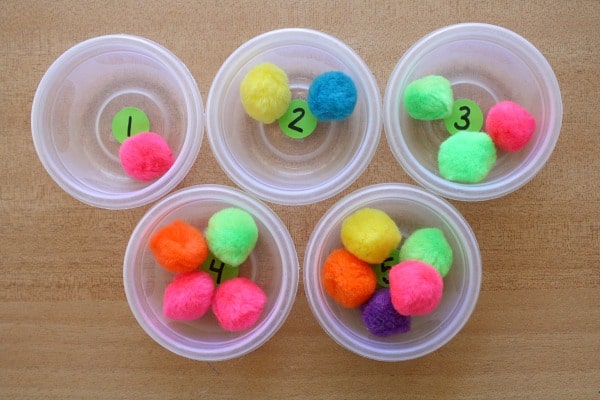 Toddler activities and counting game with Pom Poms - thedatingdivascom.bigscoots-staging.com Pom pom counting game and other toddler activities to do at home | The Dating Divas