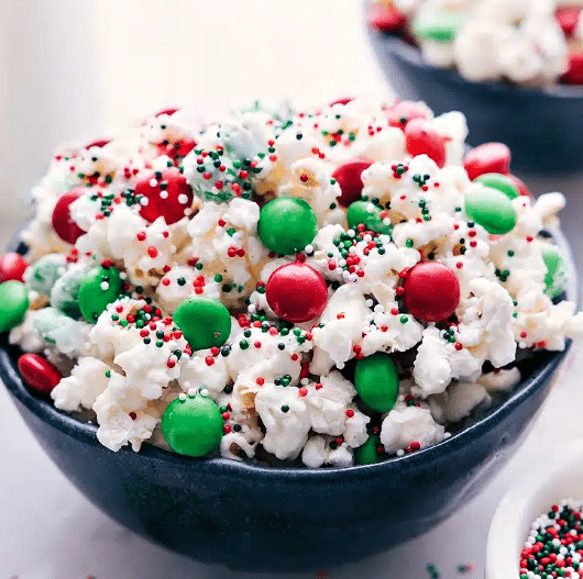 Christmas popcorn is on our awesome list of yummy and easy Christmas desserts! | The Dating Divas