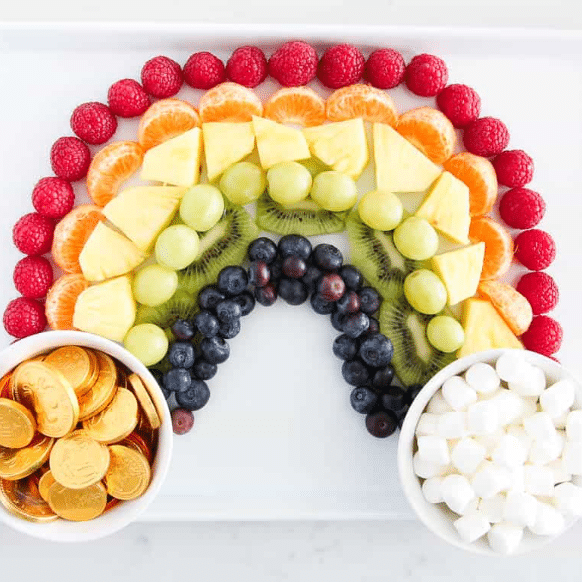 A rainbow fruit platter is the perfect St. Patrick's Day party food. | The Dating Divas