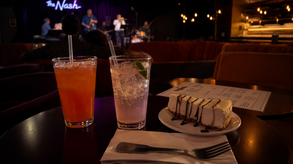 Mocktails and cheesecake on a table at a jazz club date night