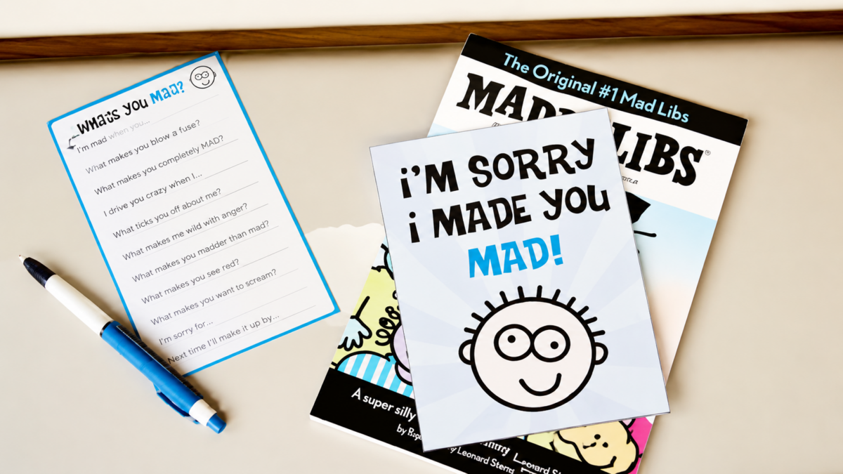 An apology note next to a book of mad libs that says "Sorry I Made You Mad"
