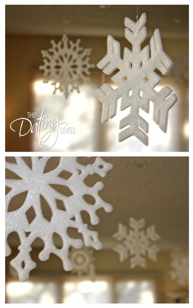 Paper and foam snowflakes hung from the ceiling for a winter date